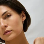 Evil Eye Huggie Earrings in 14k gold PVD, view 4